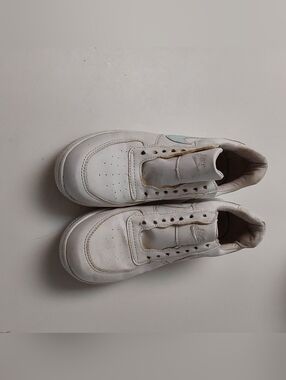 White Nike Air Force 1 Sneakers with Subtle Blue Swoosh